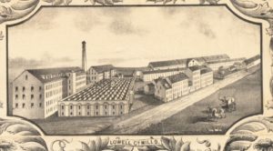 This illustration shows the Lowell Company in 1850; a series of long mill buildings with gabled roofs, five stories and many windows in the back with smaller buildings of various sizes lined up along the street.