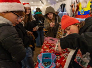 People in a tent at an artisan vendor
