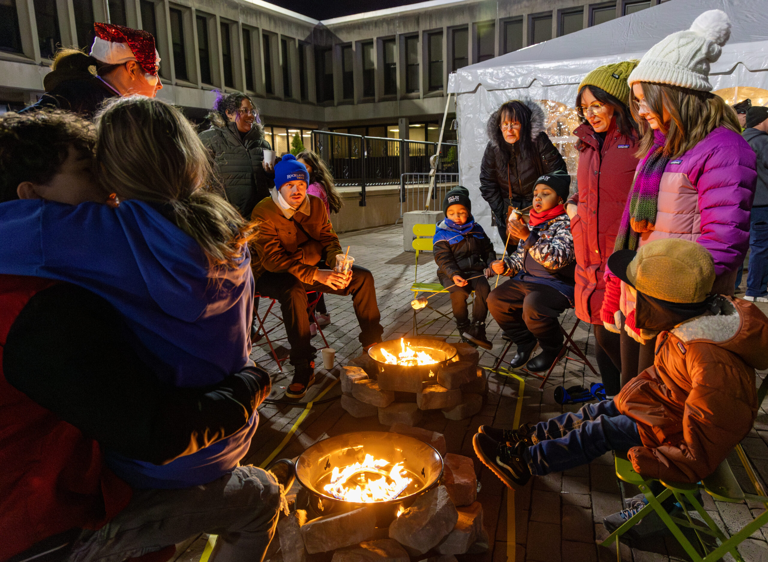 People around a campfire on JFK Plaza